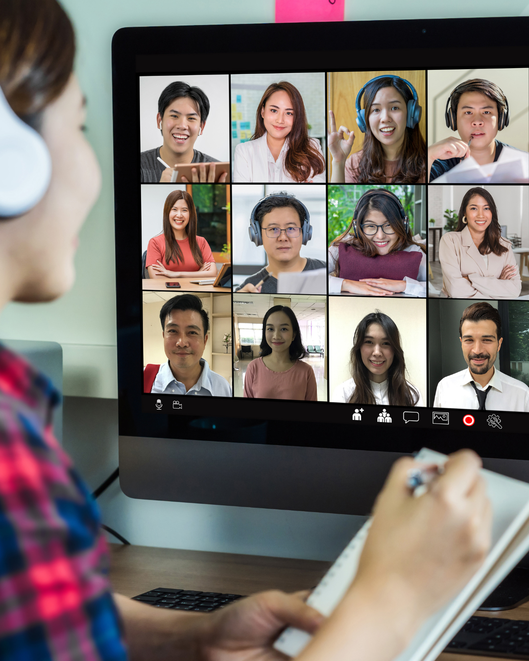 A diverse group of smiling professionals attending an online video conference, symbolizing seamless virtual collaboration for a business process outsourcing company.